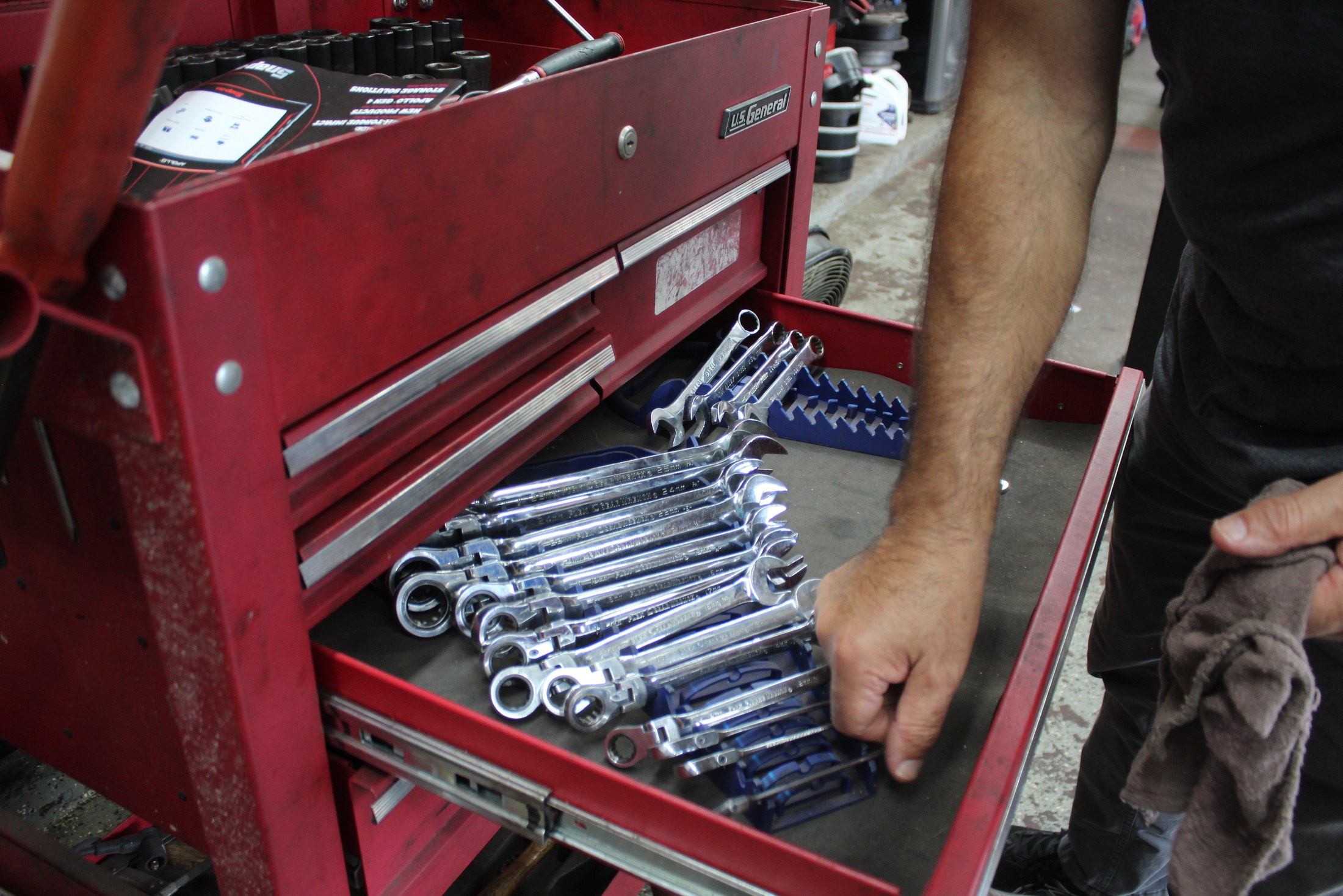 Close detail of precision tools and engine components at Galati's Foreign Car Service