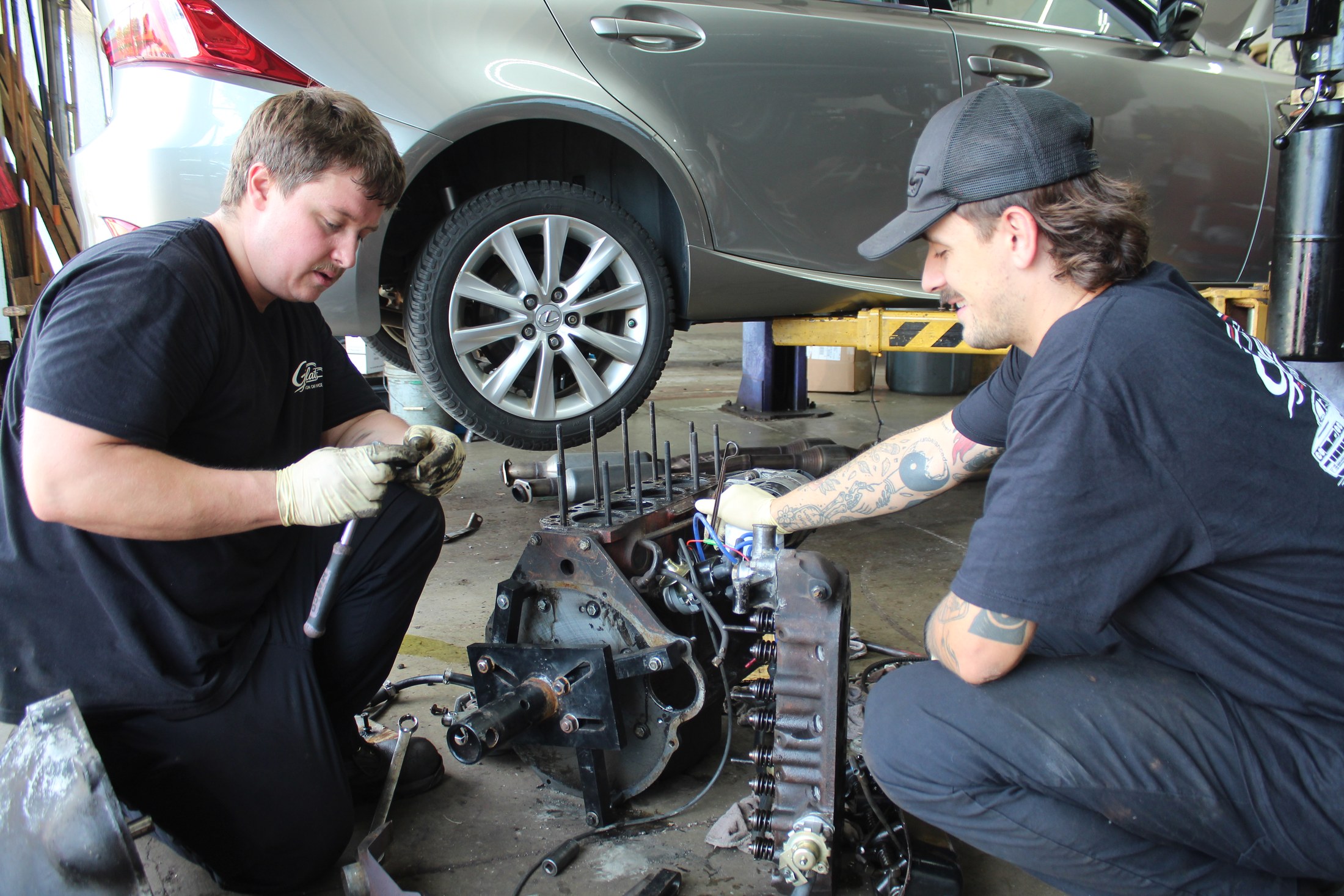 Technician performing engine and mechanical repair work at Galati's Foreign Car Service